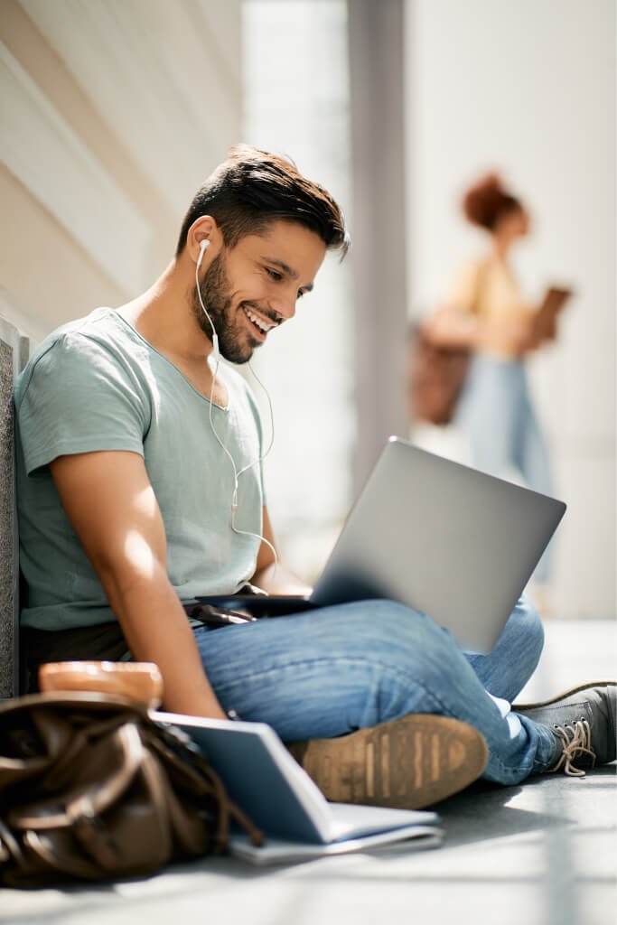 happy college student learning while using laptop 2023 11 27 04 48 59 utc.jpg